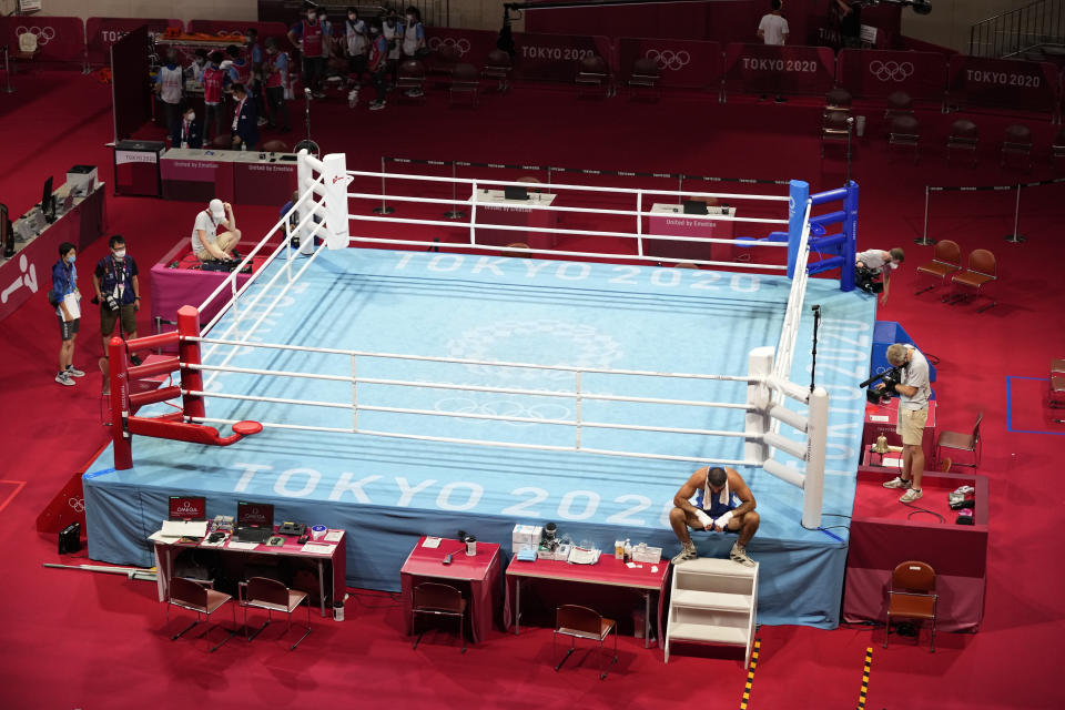 Eliad Mourad, of France refuses to leave the ring after losing a men's super heavyweight over 91-kg boxing match against Britain's Frazer Clarke at the 2020 Summer Olympics, Sunday, Aug. 1, 2021, in Tokyo, Japan. (AP Photo/Frank Franklin II)