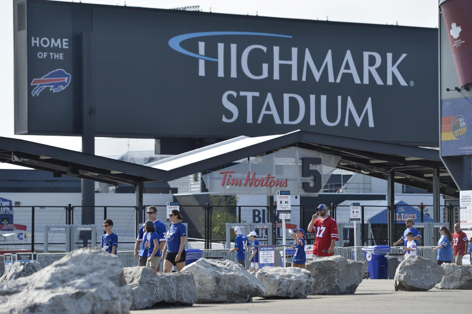 FILE - Fans walk outside Highmark Stadium before a preseason NFL football game between the Buffalo Bills and the Green Bay Packers in Orchard Park, N.Y., Saturday, Aug. 28, 2021. New York Gov. Kathy Hochul on Monday, Dec. 20, 2021, expressed confidence she can reach a deal involving hundreds of millions of dollars in public funding to build a new stadium for the Buffalo Bills in time to be included on the state’s budget due in April. (AP Photo/Adrian Kraus, File)