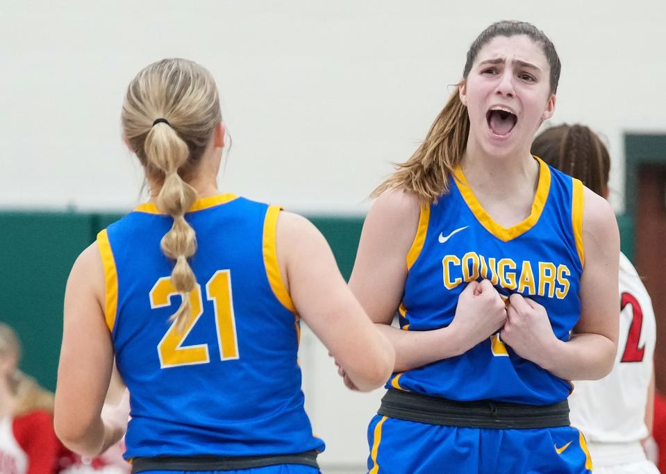 Greenfield-Central Cougars forward Madison Sonsini (5) yells in excitement after scoring a three-point basket in the final seconds before half-time Wednesday, Jan. 31, 2024, during the game at Pendleton Heights High School in Pendleton. The New Palestine Dragons defeated the Greenfield-Central Cougars, 42-35.