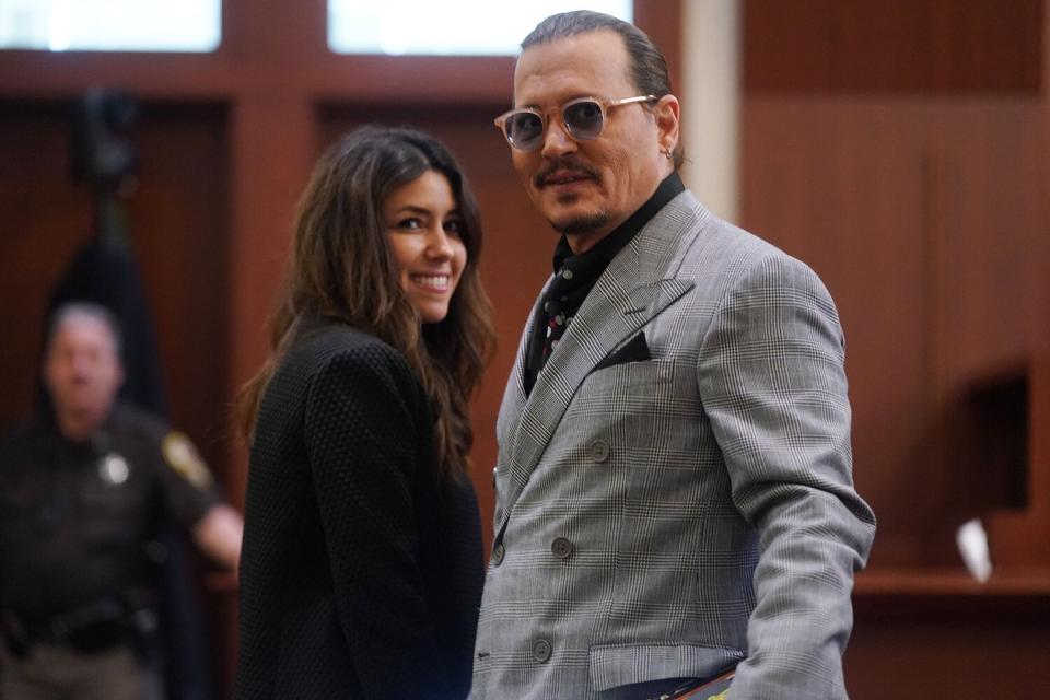 Johnny Depp (R) and his attorney Camille Vasquez (L) during a break in the 50 million US dollar Depp vs Heard defamation trial at the Fairfax County Circuit Court