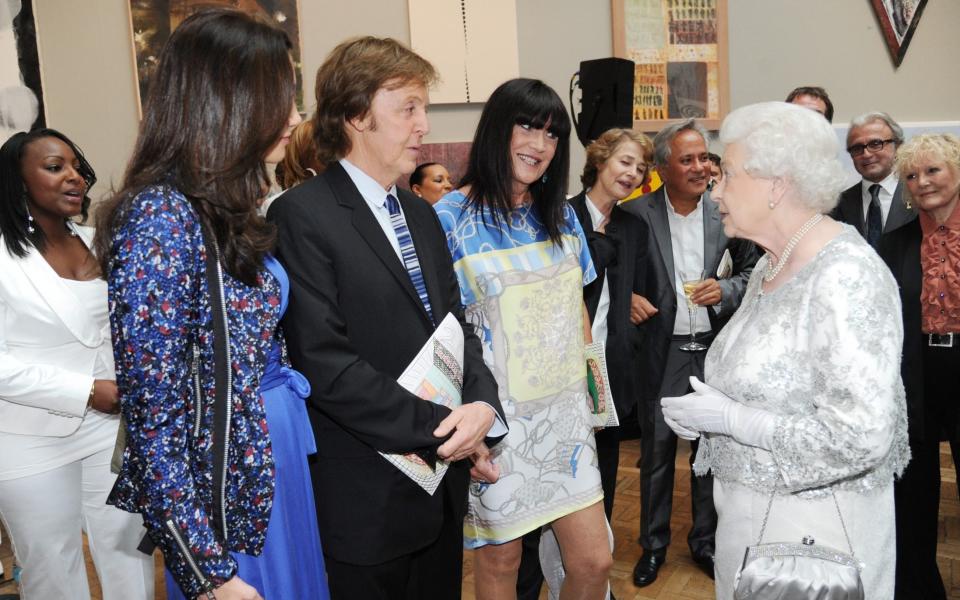 Shaw meeting the Queen at the Royal Academy of Arts in 2012, alongside Sir Paul McCartney and Nancy Shevell - Shutterstock