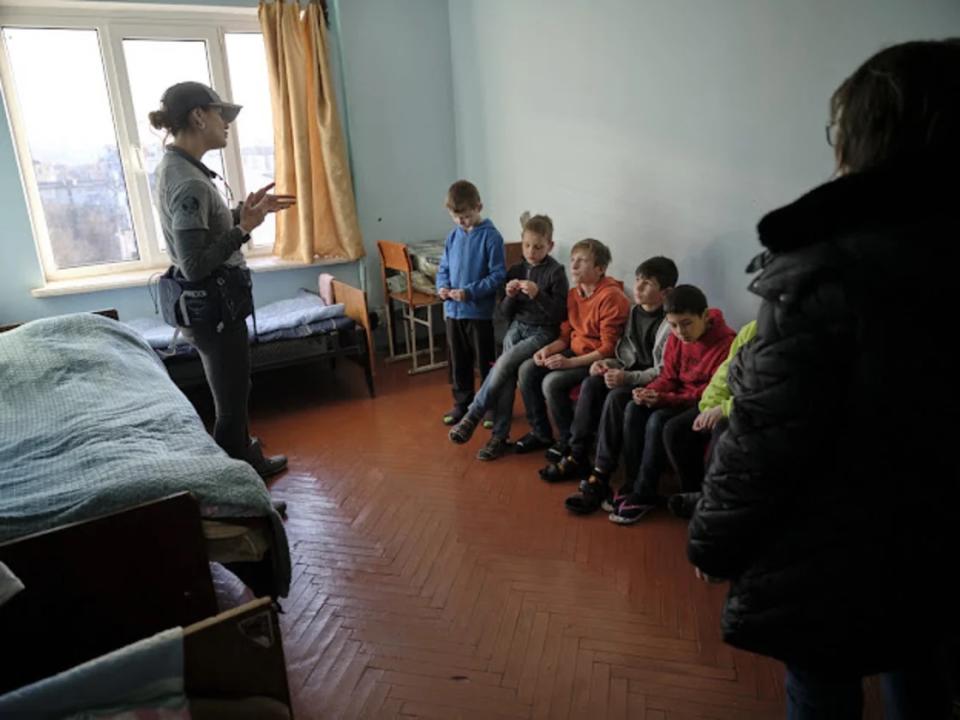 Pediatric nurse practitioner Janet Semenova-Hornstein is shown here with Ukrainian orphans in Lviv. Semenova-Hornstein assessed and treated the orphans for conditions including pneumonia and upper respiratory infections, after the children spent up to two weeks in bomb shelters. (Janet Semenova-Hornstei / Janet Semenova-Hornstei)