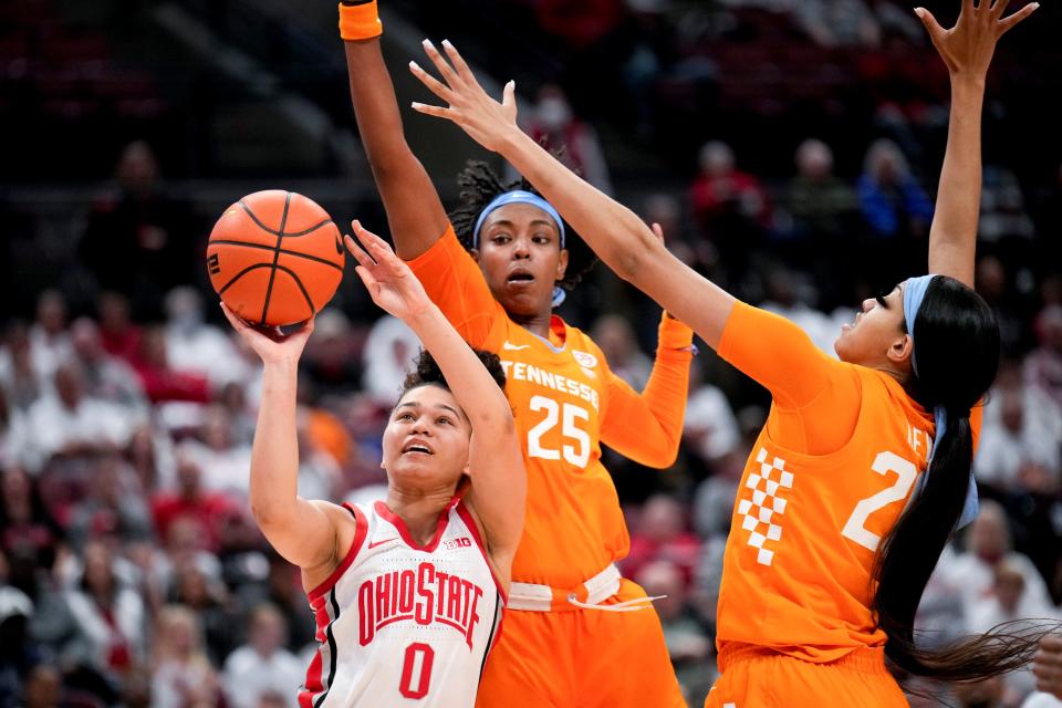 Nov 8, 2022; Columbus, OH, USA;  Ohio State Buckeyes guard Madison Greene (0) takes a shot attempt while being defended by Tennessee Lady Volunteers guard Jordan Horston (25) and Tennessee Lady Volunteers center Tamari Key (20) during the second half of the NCAA Division I women’s basketball game at Value City Arena. Mandatory Credit: Joseph Scheller-The Columbus Dispatch