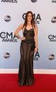 WORST: Cassadee Pope is another winner of “The Voice” who failed to impress on the red carpet. From head to toe, it’s all wrong: the hair extensions are too long and the colors clash. Her black-and-nude dress is a fashion fail. The corset-like top may have been fine, but the bottom of the dress is similarly overworked worked, the hard lines at the waist and hips drawing the eyes out and making her appear wider. REUTERS/Eric Henderson (UNITED STATES - Tags: ENTERTAINMENT)