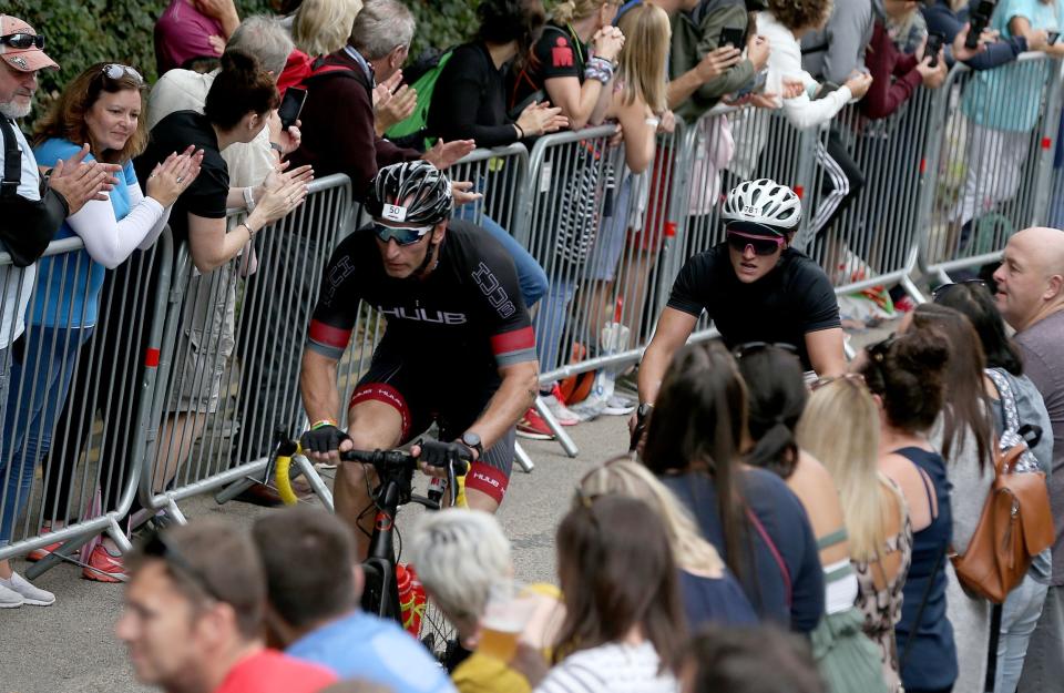 Former Welsh rugby International captain Gareth Thomas (L) competes during Ironman Wales. (Getty Images for IRONMAN)