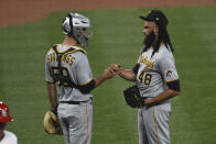 Pittsburgh Pirates catcher Jacob Stallings celebrates with Pittsburgh Pirates relief pitcher Richard Rodriguez after beating the St. Louis Cardinals in a baseball game Friday, June 25, 2021, in St. Louis. (AP Photo/Joe Puetz)