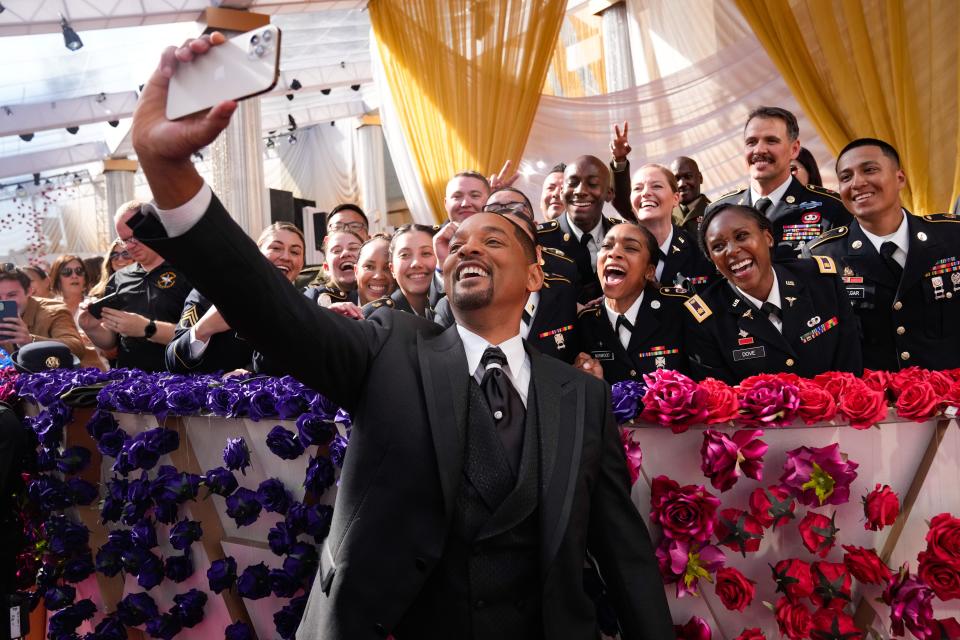 Will Smith arrives at the 94th Academy Awards and takes a selfie with fans outside the Dolby Theatre.