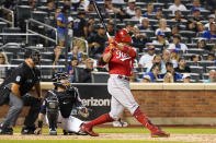 Cincinnati Reds' Joey Votto, right, watches his solo home run in the sixth inning of the baseball game against the New York Mets, Friday, July 30, 2021, in New York. (AP Photo/Mary Altaffer)