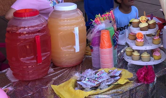 Eight-year-old Hope Campos had help from her mother preparing strawberry lemonade, cherry lemonade and lemon-vanilla cupcakes to sell at her stand at Amigos supermarket Saturday morning as part of Lemonade Day.