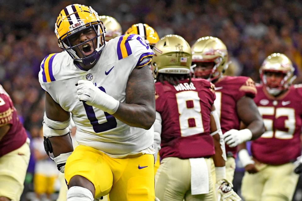 Sep 4, 2022; New Orleans, Louisiana, USA; Louisiana State Tigers defensive tackle Maason Smith (0) celebrates a play during the first half against the Florida State Seminoles at Caesars Superdome. Mandatory Credit: Melina Myers-USA TODAY Sports