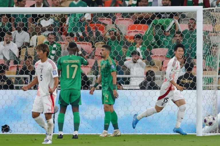 On target: Japan forward Daichi Kamada celebrates after scoring his team's first goal against Saudi Arabia (-)