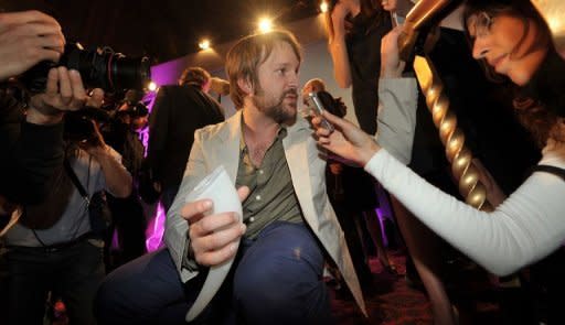 Chef Rene Redzepi (C) of Danish restaurant Noma speaks to the media after winning first place at the S.Pellegrino 'World's 50 Best Restaurants Awards 2011', in central London. He won the same award this year for the third time in a row