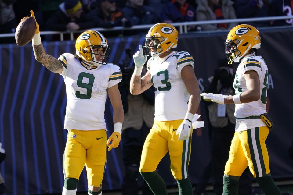 Green Bay Packers' Christian Watson celebrates his touchdown catch during the first half of an NFL football game against the Chicago Bears Sunday, Dec. 4, 2022, in Chicago. (AP Photo/Charles Rex Arbogast)