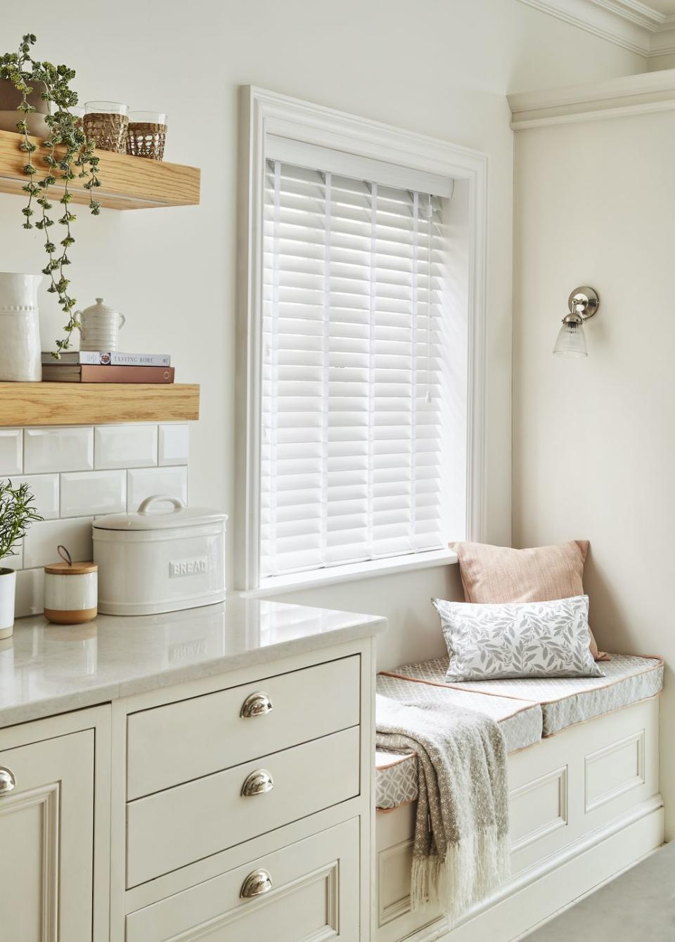 cream kitchen with a window seat