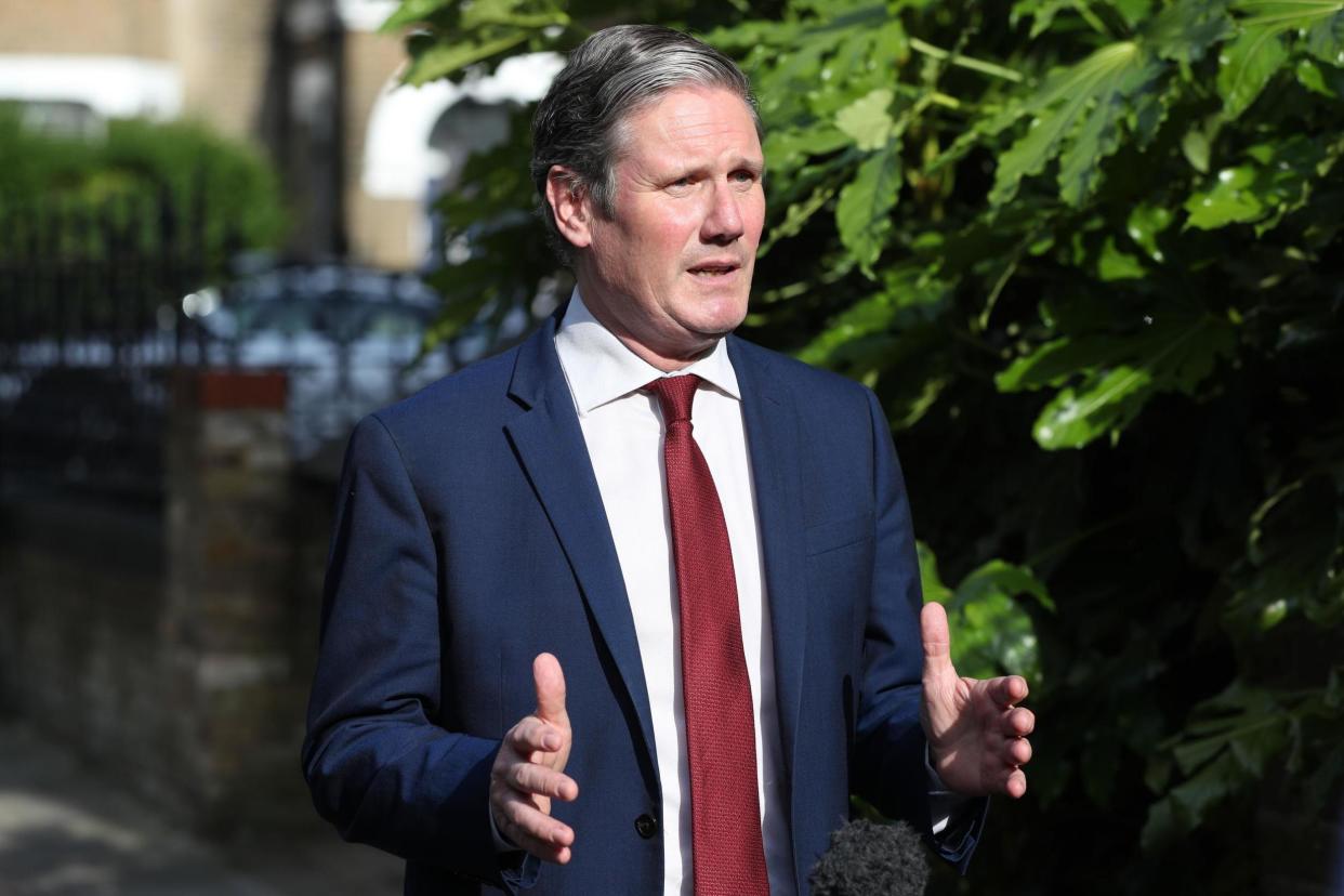 Labour leader Sir Keir Starmer recording a piece to camera outside his home in north London: PA