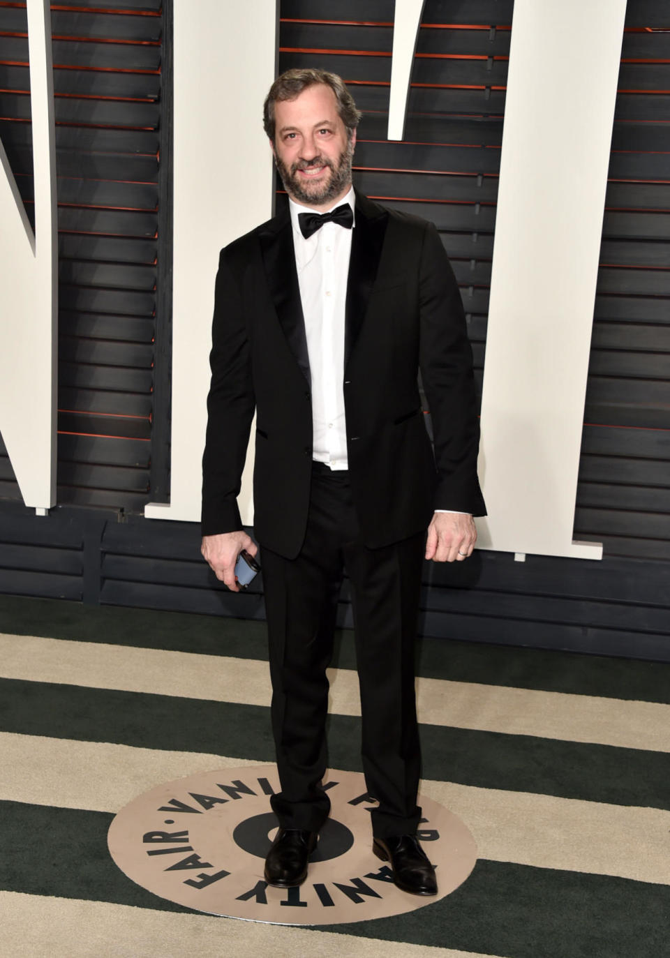 Judd Apatow letting loose and undoing his tux button at the 2016 Vanity Fair Oscar Party at the Wallis Annenberg Center for the Performing Arts on February 28, 2016.