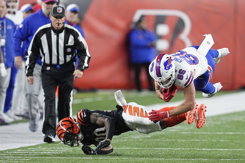 Buffalo Bills tight end Dalton Kincaid (86) is brought down by Cincinnati Bengals cornerback DJ Turner II during the second half of an NFL football game, Sunday, Nov. 5, 2023, in Cincinnati. (AP Photo/Darron Cummings)