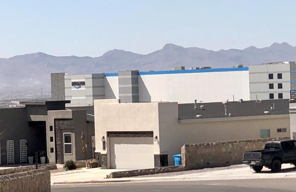 The giant Amazon distribution center looms near a nearby residential neighborhood as seen March 9 in far East El Paso County.