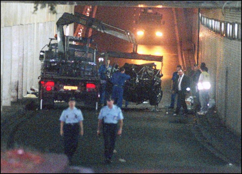 The wreckage of Princess Diana’s car is lifted. AFP via Getty Images