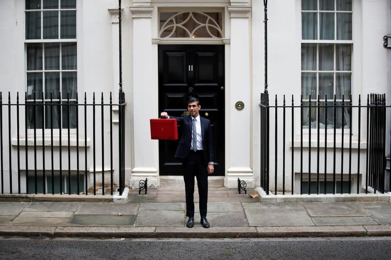 Chancellor of the Exchequer Sunak holds the budget box outside Downing Street in London