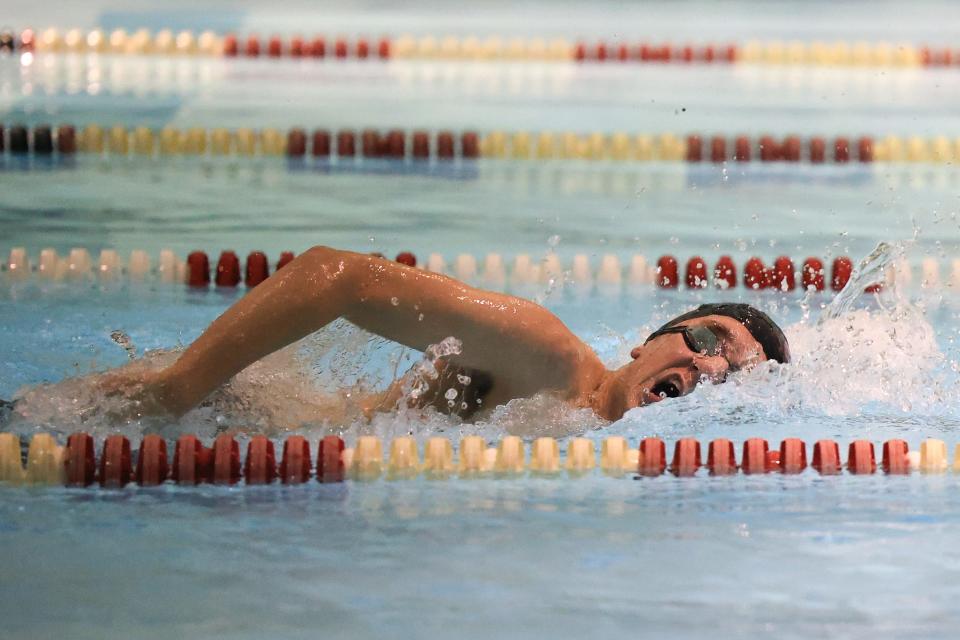 Aurora’s Ben Mulvaney swims in the Boys 100 Yard Freestyle event during a meet against Kent Roosevelt High School Monday, January 10 at the Kent Roosevelt Natatorium.