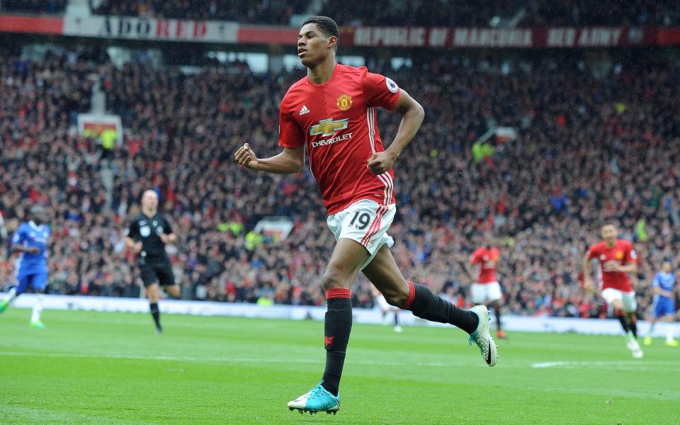 Manchester United's Marcus Rashford celebrates after scoring his side's first goal - Credit: AP