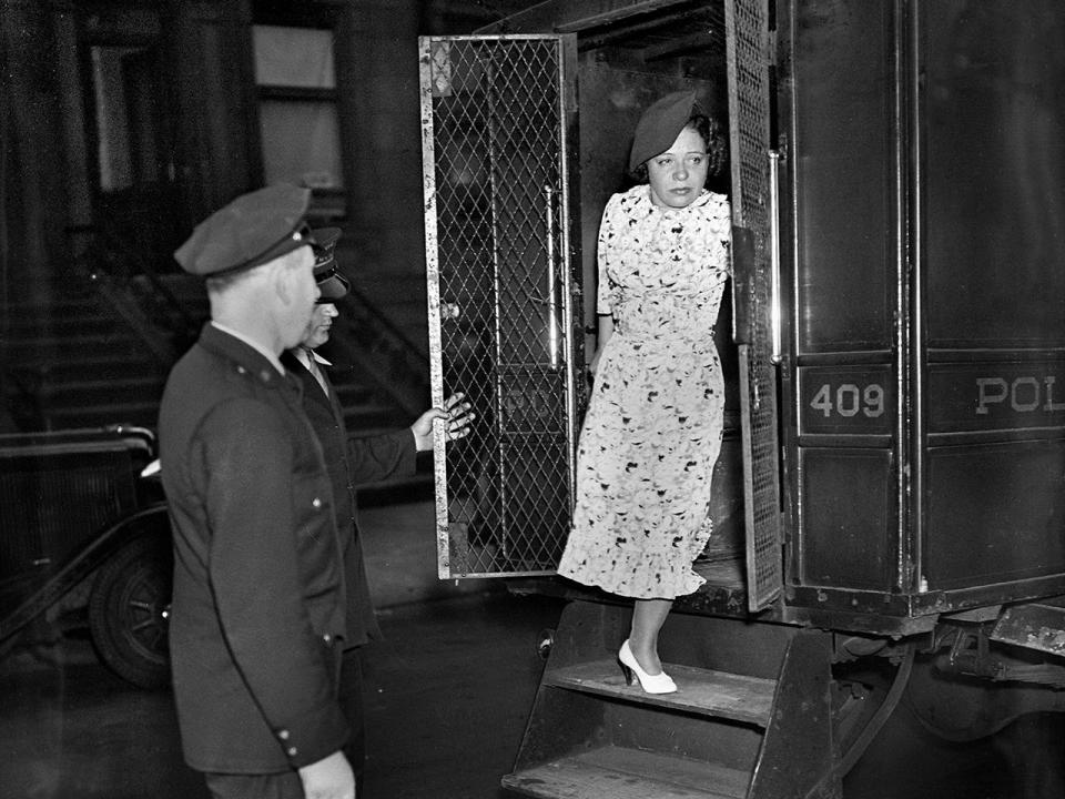 Polly Adler leaving a police van after being arrested in a raid, July 12, 1936, in New York City.  / Credit: N.Y. Daily News Archive via Getty Images