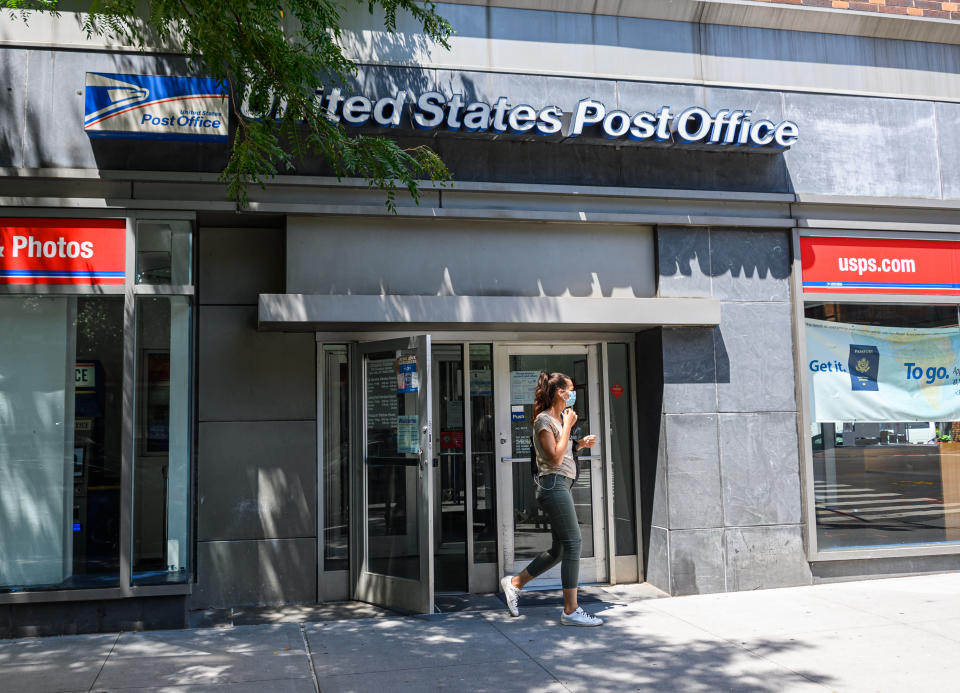 NEW YORK, NEW YORK - JULY 28: A person wears a protective face mask  outside the United States Post Office on the Upper West Side as the city continues Phase 4 of re-opening following restrictions imposed to slow the spread of coronavirus on July 28, 2020 in New York City. The fourth phase allows outdoor arts and entertainment, sporting events without fans and media production. (Photo by Noam Galai/Getty Images)