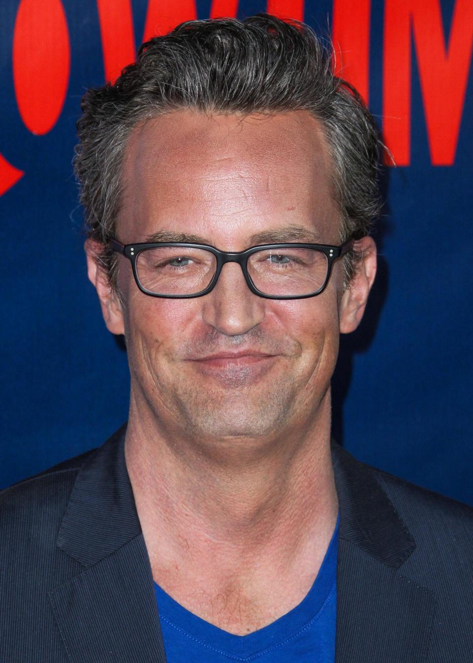 Matthew Perry wearing glasses