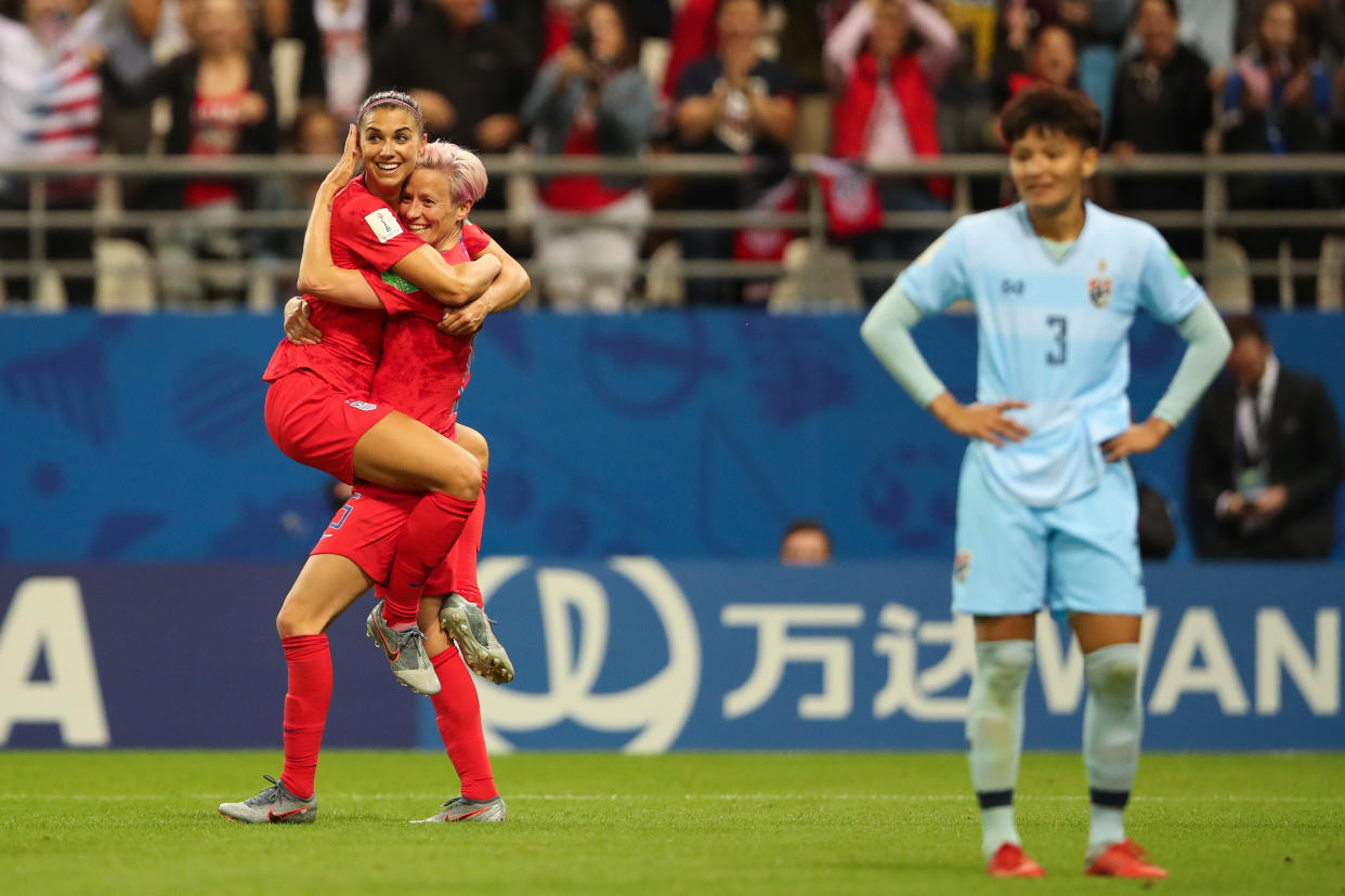 REIMS, FRANCE - JUNE 11: Alex Morgan of USA celebrates with Megan Rapinoe of USA  after scoring a goal to make it 12-0 during the 2019 FIFA Women's World Cup France group F match between USA and Thailand at Stade Auguste Delaune on June 11, 2019 in Reims, France. (Photo by Molly Darlington - AMA/Getty Images)