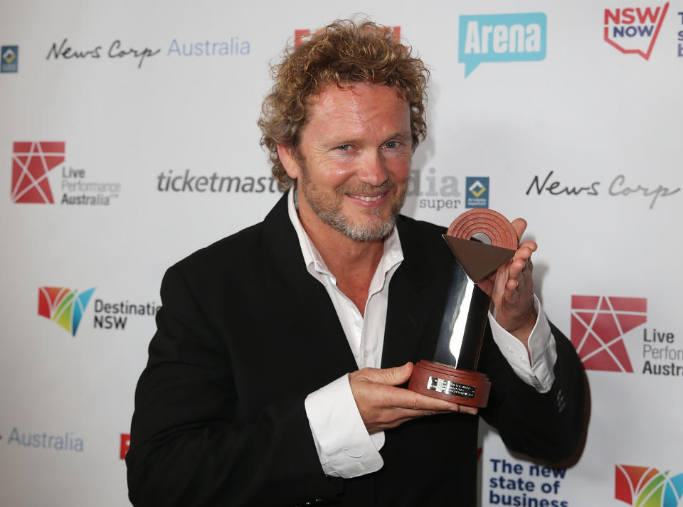 Craig McLachlan poses with the award for Best Actor in a Musical at the Capitol Theatre on August 18, 2014 in Sydney, Australia.  (Photo by Mark Metcalfe/Getty Images)