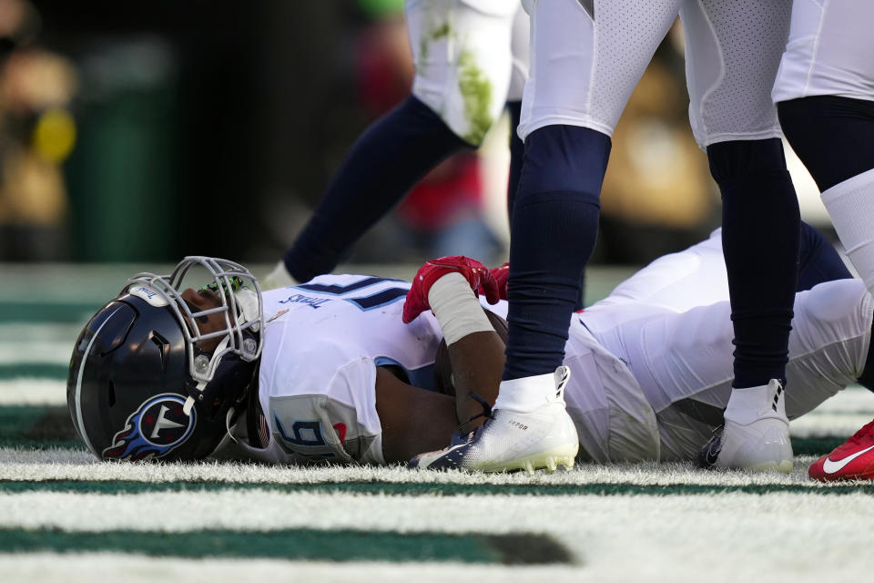Tennessee Titans' Treylon Burks lies on the ground injured after scoring a touchdown during the first half of an NFL football game against the Philadelphia Eagles, Sunday, Dec. 4, 2022, in Philadelphia. (AP Photo/Matt Slocum)