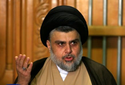 FILE PHOTO: Iraqi Shi'ite cleric Moqtada al-Sadr speaks during a news conference with Iraqi politician Ammar al-Hakim, leader of the Hikma Current, in Najaf, Iraq, May 17, 2018. REUTERS/Alaa al-Marjani/File Photo