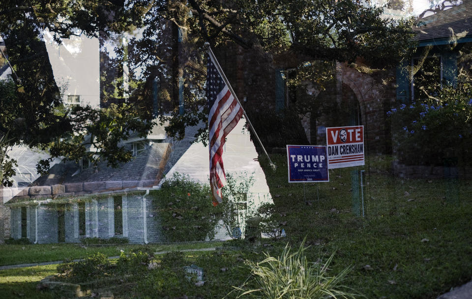 Image: Double exposure of Trump lawn signs and a house with an American flag (Lizzie Chen / for NBC News)