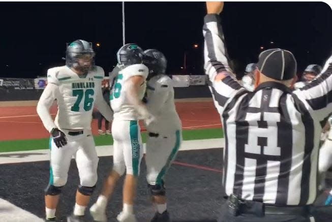 Highland players celebrate after the Hawks scored the winning touchdown against Red Mountain Friday, Nov. 4, 2022.