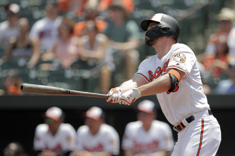 Baltimore Orioles' Trey Mancini watches his home run off Boston Red Sox starting pitcher Andrew Cashner during the first inning of a baseball game, Sunday, July 21, 2019, in Baltimore. (AP Photo/Julio Cortez)