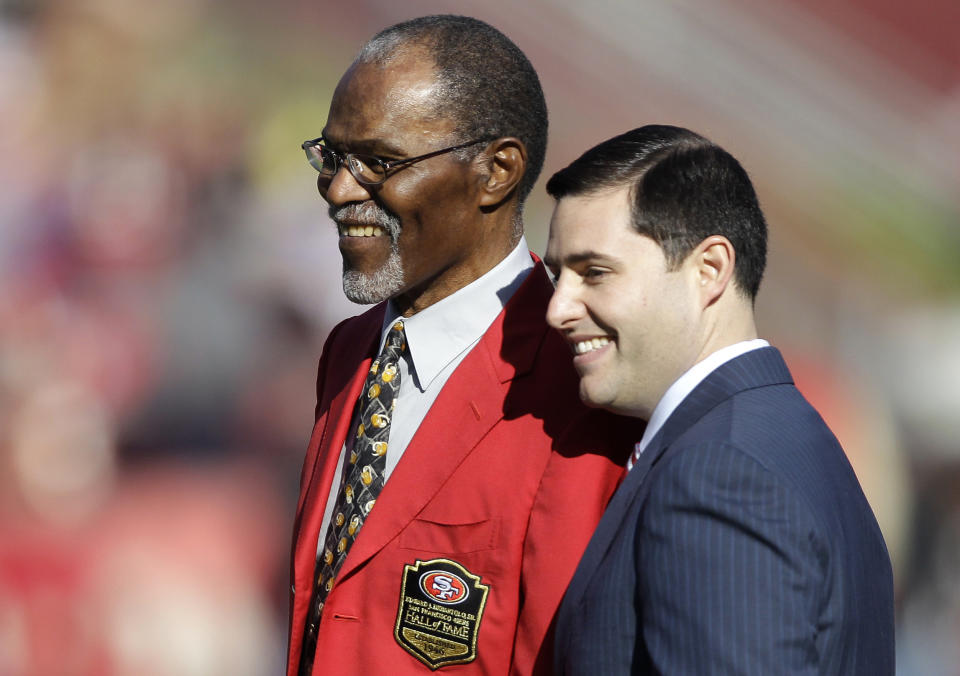FILE - San Francisco 49ers Hall of Fame football player Jimmy Johnson, left, is honored by owner Jed York before an NFL game between the 49ers and St. Louis Rams in San Francisco, Sunday, Dec. 4, 2011. Pro Football Hall of Fame defensive back Jimmy Johnson, a three-time All-Pro and member of the All-Decade Team of the 1970s, has died. He was 86. Johnson's family told the Pro Football Hall of Fame that he died on Wednesday night, May 8, 2024. (AP Photo/Paul Sakuma, File)