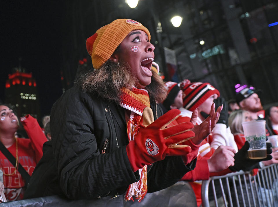 Kansas City Chiefs fan Porschae Oglesby reacts after a play during a Super Bowl 58 watch party at the Power and Light District, Sunday, Feb. 11, 2024, in Kansas City, Mo. (AP Photo/Peter Aiken)