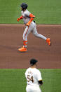 San Francisco Giants' Thairo Estrada, top, rounds the bases after hitting a two-run home run off Pittsburgh Pirates starting pitcher Martín Pérez (54) during the fifth inning of a baseball game in Pittsburgh, Tuesday, May 21, 2024. (AP Photo/Gene J. Puskar)