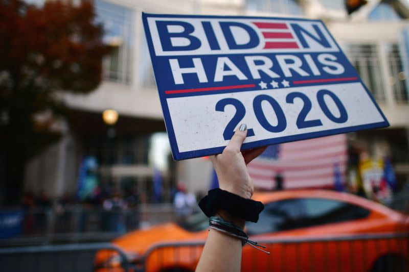 Supporters of President-elect Joe Biden shout across the street towards supporters of U.S. President Donald Trump, the day after a presidential election victory was called for Biden, in Philadelphia, Pennsylvania