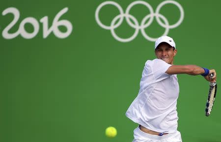 2016 Rio Olympics - Tennis - Preliminary - Men's Singles Second Round - Olympic Tennis Centre - Rio de Janeiro, Brazil - 09/08/2016. Evgeny Donskoy (RUS) of Russia in action against David Ferrer (ESP) of Spain. REUTERS/Toby Melville