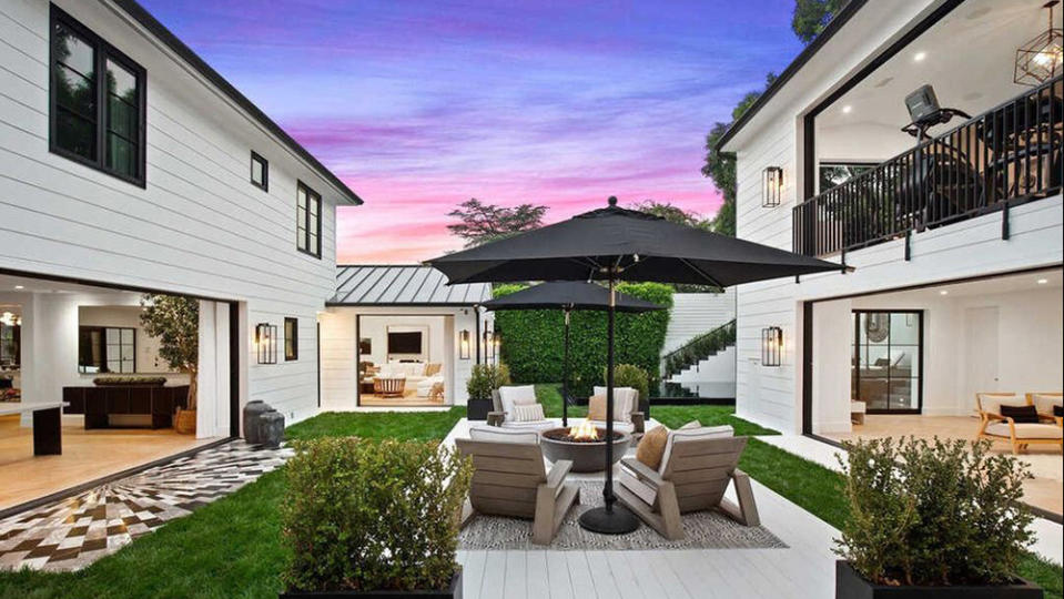 Backyard seating centered between the main and guest houses. - Credit: Realtor.com