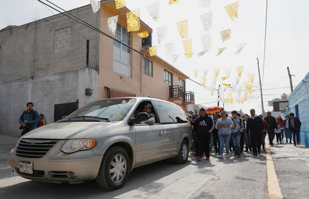 Relatives and friends take part in a funeral procession for Cesar Jimenez Brito, 40, who died during the explosion of a fuel pipeline ruptured by suspected oil thieves, in the municipality of Tlahuelilpan, state of Hidalgo, Mexico January 20, 2019. REUTERS/Henry Romero