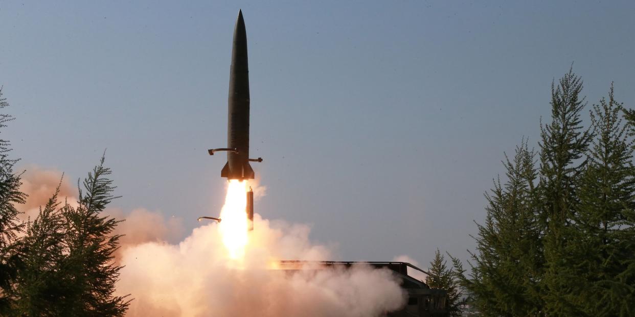 A missile is seen launched during a military drill in North Korea