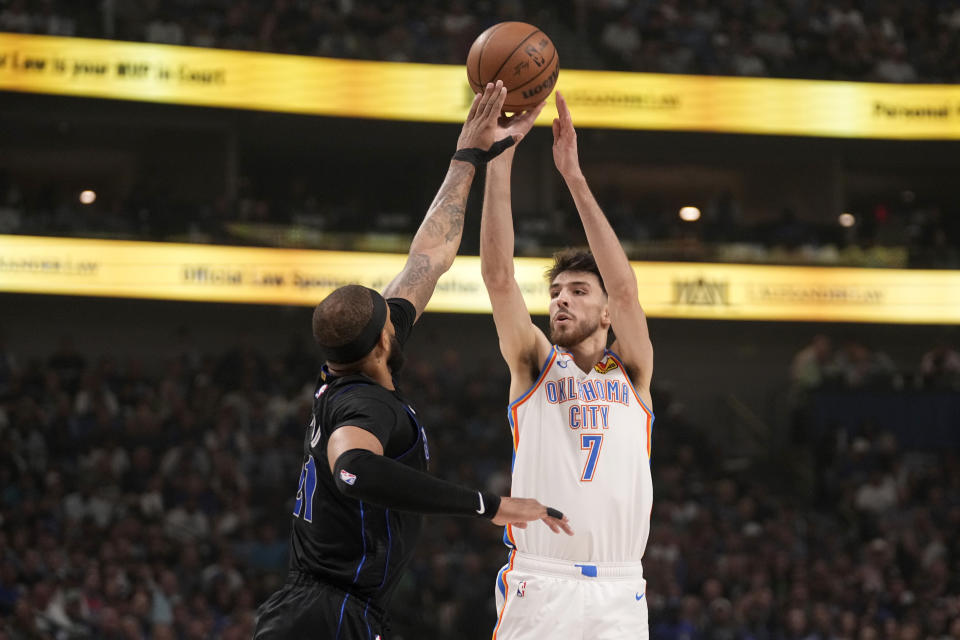 Oklahoma City Thunder's Chet Holmgren (7) shoots over Dallas Mavericks center Daniel Gafford in the first half of Game 6 of an NBA basketball second-round playoff series Saturday, May 18, 2024, in Dallas. (AP Photo/Tony Gutierrez)