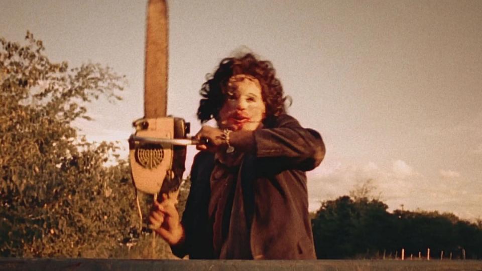 Leatherface in Texas Chainsaw Massacre holding best horror weapon a chainsaw