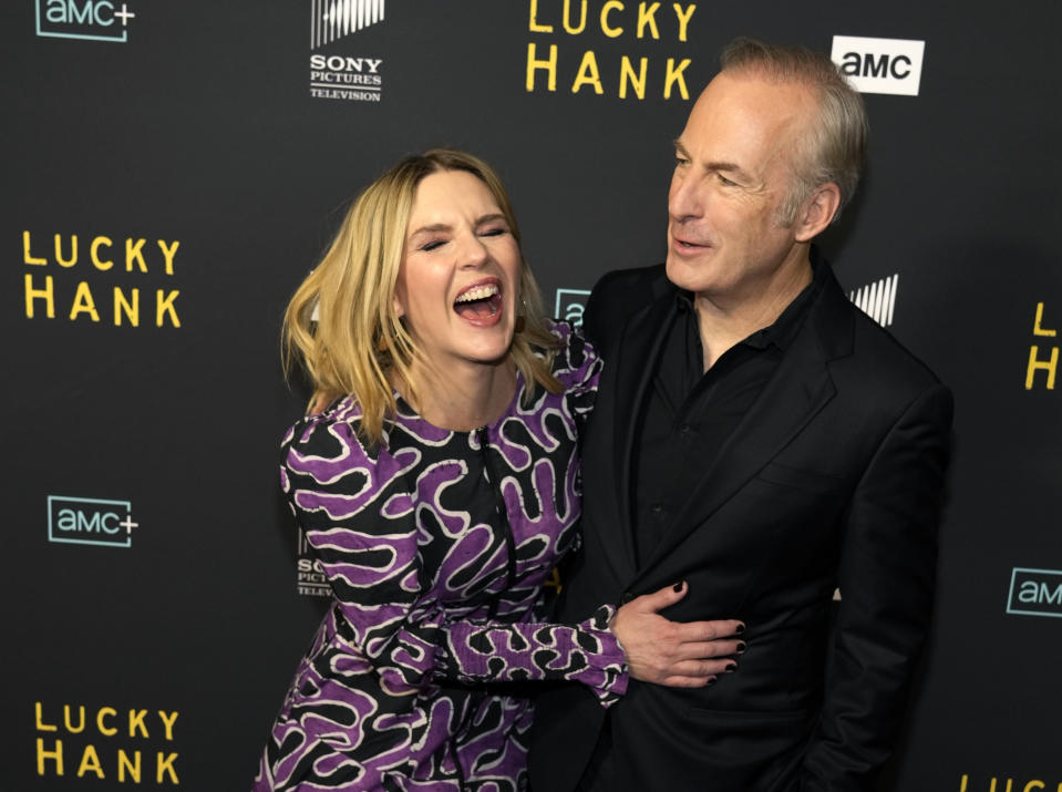 Bob Odenkirk, right, the star and executive producer of the AMC television series "Lucky Hank," shares a laugh with actor Rhea Seehorn at the premiere of the series, Wednesday, March 15, 2023, at the London Hotel in West Hollywood, Calif. Odenkirk and Seehorn were fellow cast members in the AMC series "Better Call Saul." (AP Photo/Chris Pizzello)