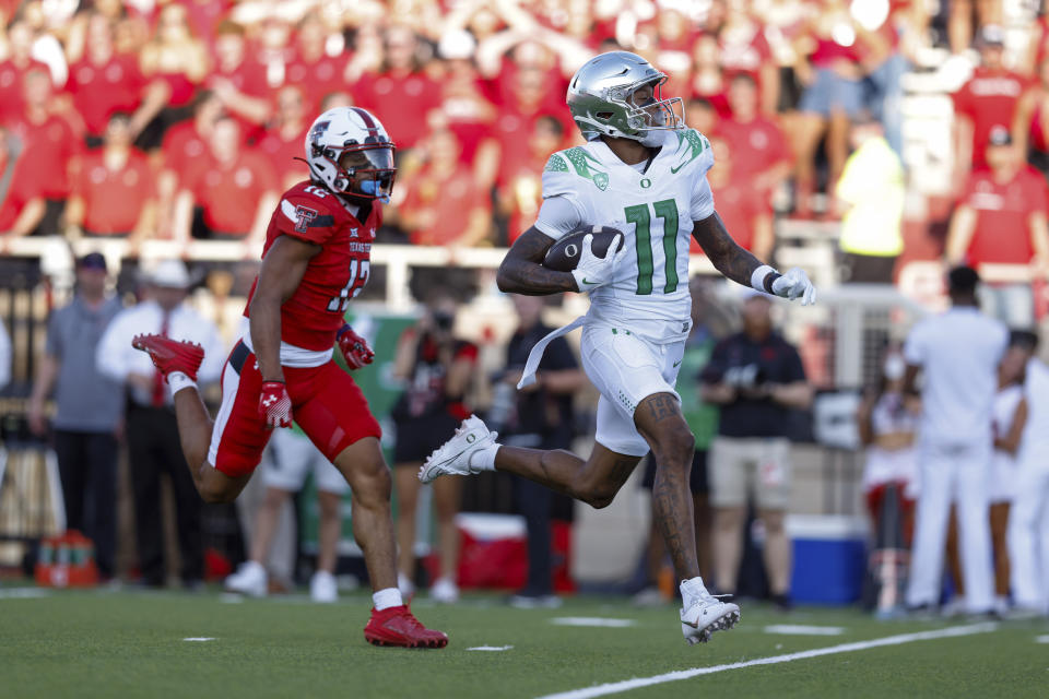 Oregon wide receiver Troy Franklin (11) scores a touchdown against Texas Tech during the first half of an NCAA college football game, Saturday, Sept. 9, 2023, in Lubbock, Texas. (AP Photo/Chase Seabolt)