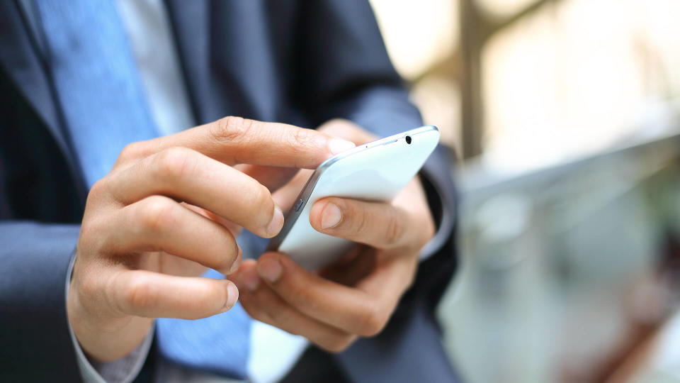 man holding smartphone