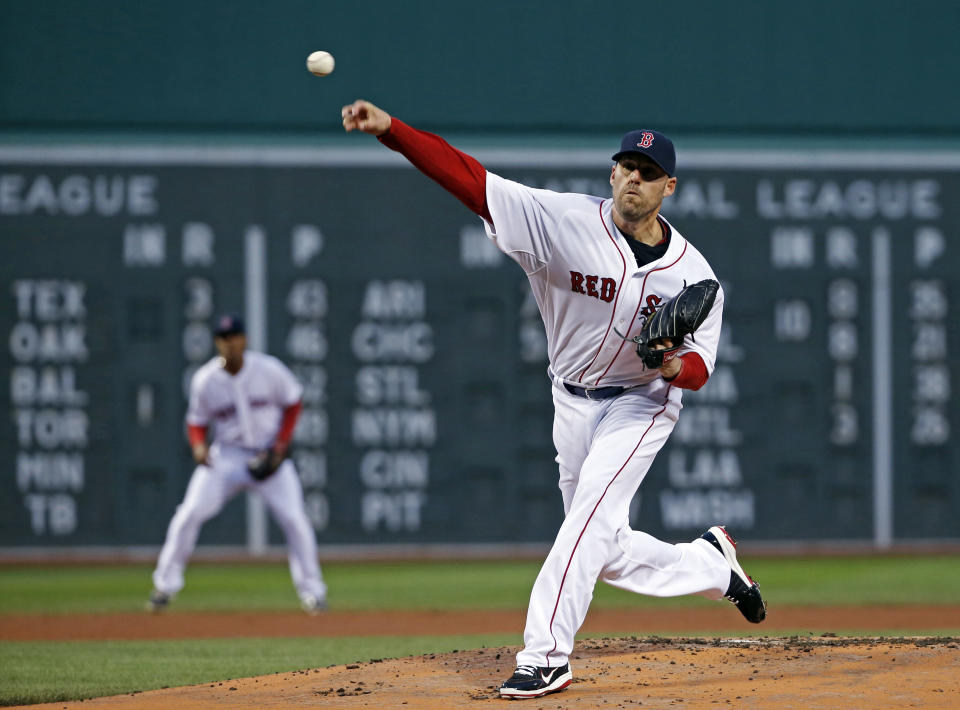 Boston Red Sox starting pitcher John Lackey delivers to the New York Yankees during the first inning of a baseball game at Fenway Park in Boston, Wednesday, April 23, 2014. (AP Photo/Elise Amendola)